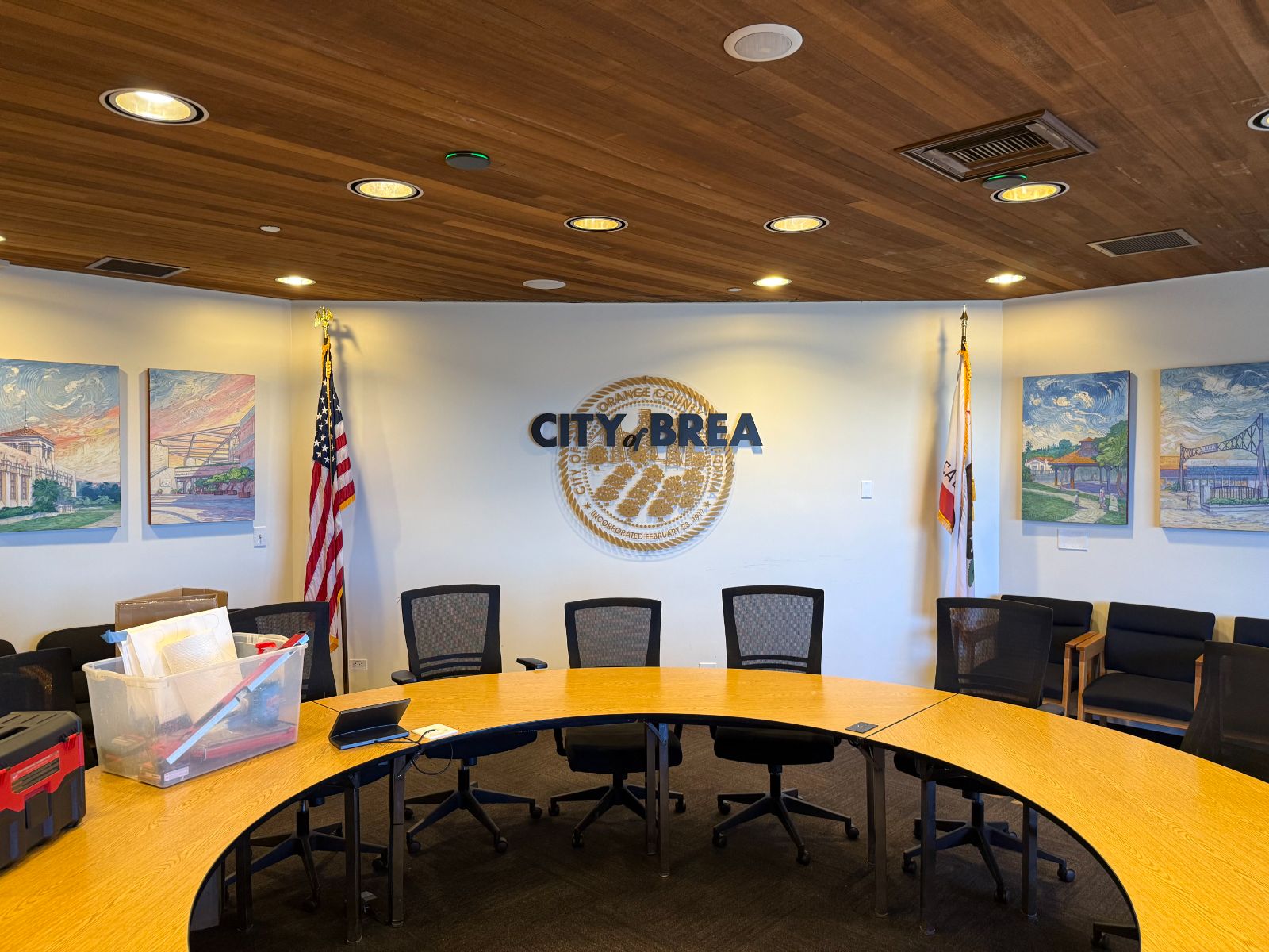 City of Brea council chamber wall: dark blue dimensional 'City of Brea' letters over a printed gold city seal